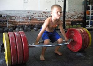 little-kid-lifting-trap-bar-deadlift