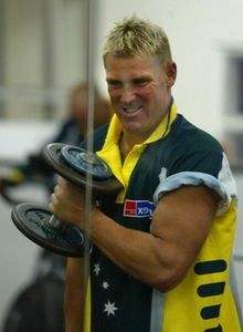 BRISBANE - AUGUST 22: Shane Warne of Australia performs bicep curls during a weights training session for the Australian cricket team held today at the Brisbane Grammar School in Brisbane, Australia on August 22, 2002. (Photo by Jonathan Wood/Getty Images)